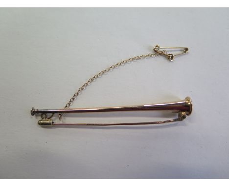 A 15ct yellow gold hunting horn brooch/pin, 65mm long, approx 3.6 grams, in generally good condition 