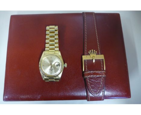 A 1975 18ct gents Rolex Oyster perpetual date just wristwatch, with 18ct gold bracelet, date calendar, original box and certi