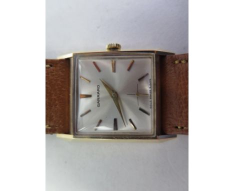 A 9ct yellow gold Garrard manual wind gents wristwatch with secondary dial, 28mm wide including button, clean running order, 