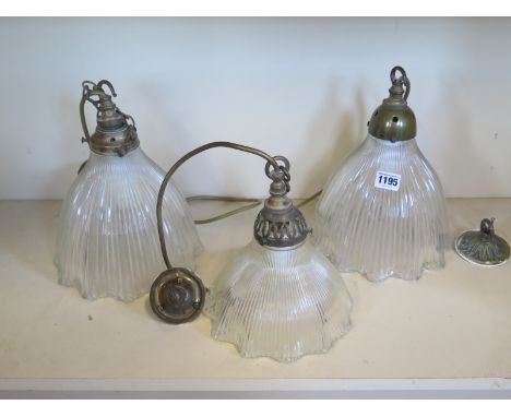 Three holophane glass ceiling lamps, including a matched pair, approx 25 cm high, and a single lamp, approx 20cm high - shade