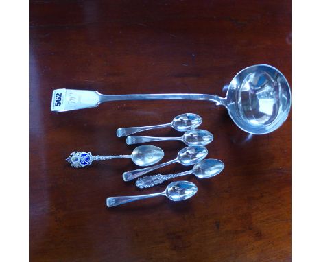 A large Victorian silver ladle with engraved initials, possibly MWB, and four teaspoons with same initials, along with two ot