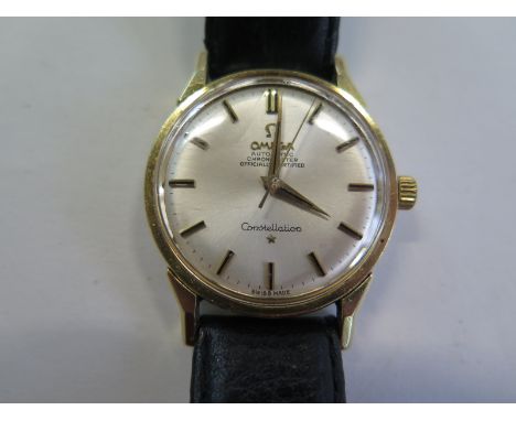 An Omega automatic Chronometer Constellation bi metal wristwatch on a leather strap, 36mm wide including button, running orde