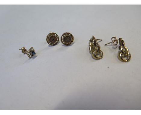 A pair of 9ct gold and diamond earrings, 9mm diameter, and single blue sapphire stud earring with yellow metal mount and a 9c