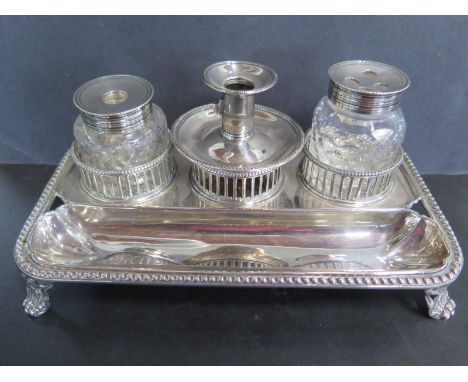 A Georgian two bottle desk stand with taper stick London 1775/76, maker BD Burrage Davenport 18cm x 10cm, total silver weight