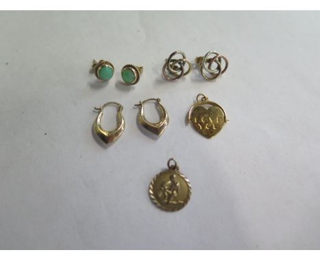 Two pairs of 9ct gold earrings with a pair of 9ct and jade style earrings and two charms, one marked 9K the other with a 9ct 