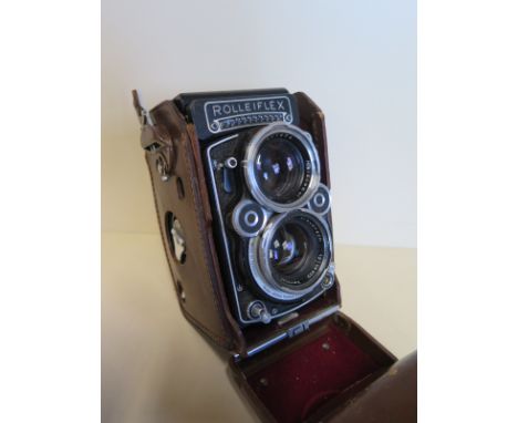 A Rolleiflex f2.8 twin reflex camera with side mounted light meter 