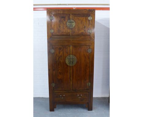 Chinese&nbsp;hardwood wardrobe cabinet, with stylised brass handles and hinges, comprising two parts, the base with two cupbo