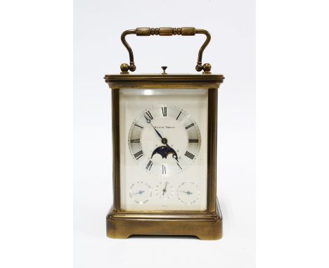 A brass repeating carriage clock by Matthew Norman of Switzerland, four glass panels, silvered dial with Roman numeral chapte