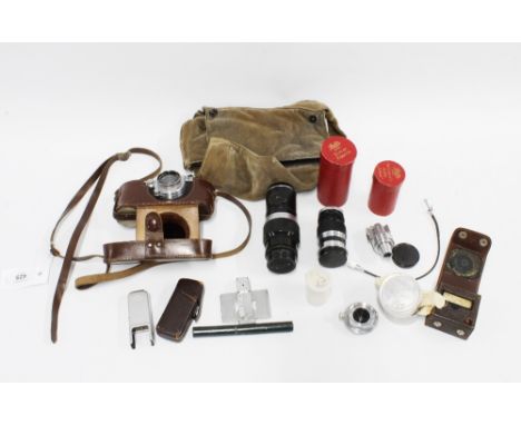 A Leica 'A' 35mm Rangefinder camera, with f.5cm lens and leather case; a Leitz f=2.8m 1:6:3; light meter in a case, a Leitz f