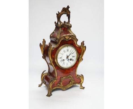 A French red tortoiseshell and gilt metal mounted mantel clock, 40cm high