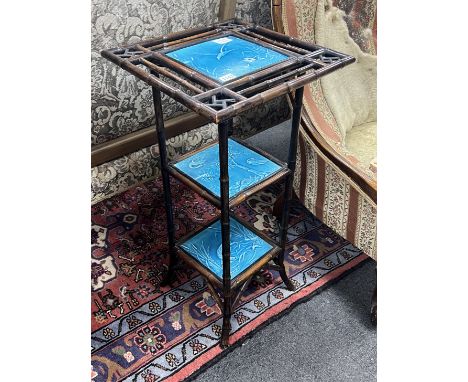 A Victorian Aesthetic movement bamboo and Minton tile inset three tier stand, width 38cm, height 76cm