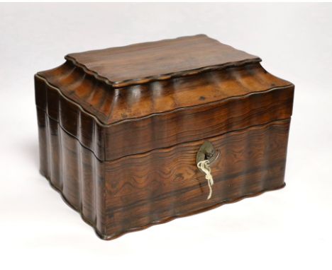 A Ceylonese calamander tea caddy, c.1820, with four internal compartments and key, 29cm wide