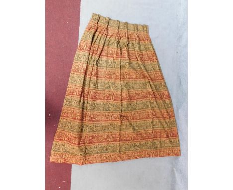 A pair of lined curtains with figural Inca style motifs. In good and clean condition. H.208 W.86 D.190cm 