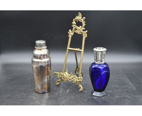 A silver plated cocktail shaker by Christofle, maker's mark to underside, a blue crystal Lampe Berger spirit burner by Maison