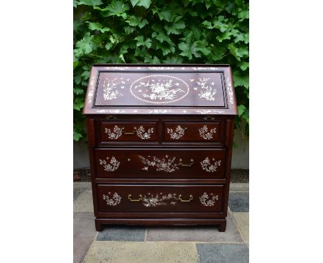 A Chinese hardwood bureau with fall front revealing fitted interior and with profuse all over mother of pearl inlay. H.108 W.