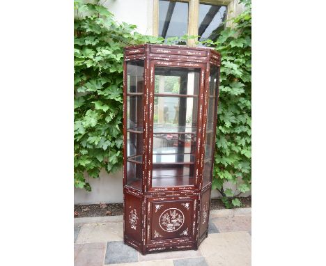 A Chinese hardwood two section floor standing display cabinet with profuse all over mother of pearl inlay. H.190 W.97 D.36cm 