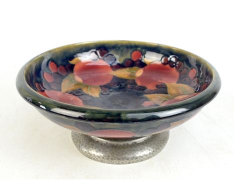 MOORCROFT; a 'Pomegranate' bowl raised on Tudric pewter base, impressed number 01312 to base, diameter 25cm.Additional Inform