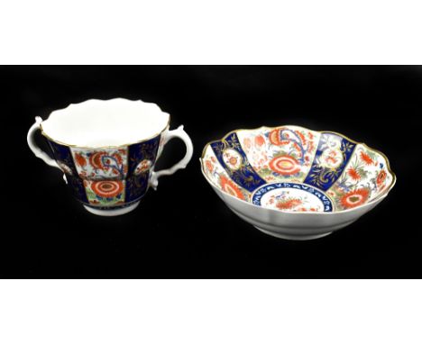 WORCESTER; a large 18th century first period twin handled chocolate cup and saucer, decorated in the 'Wheat Sheaf' pattern wi