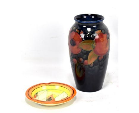 MOORCROFT;&nbsp;a 'Pomegranate' pattern tube line decorated baluster vase on navy ground, WM monogram and impressed marks to 