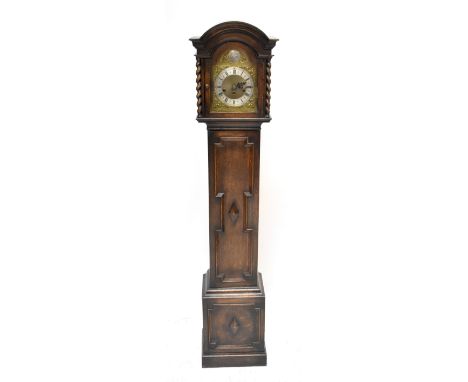A 1930s oak grandmother clock with arched dial inscribed 'Tempus Fugite', height 160cm.