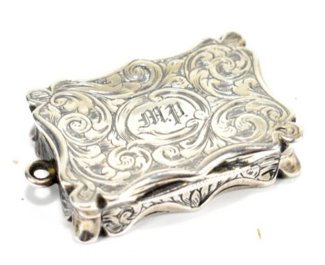 EDWARD SMITH; an early Victorian hallmarked silver vinaigrette of rectangular form with engraved foliate decorated cover set 