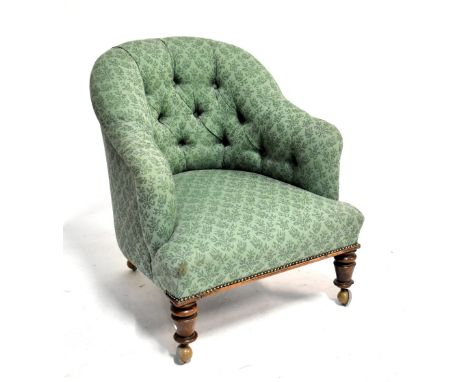 A Victorian button upholstered armchair.