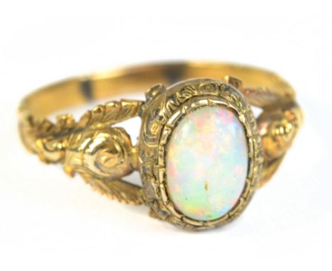 A yellow metal opal dress ring, with floral decoration to the shoulders, size O, approx 1.8g.