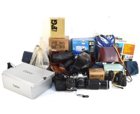 A quantity of camera equipment including a modern tripod.