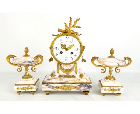 A circa 1900 French veined marble and brass three-piece clock garniture, the drum head eight day clock with white enamel dial