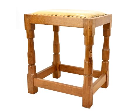 ROBERT 'MOUSEMAN' THOMPSON; an oak framed stool with leather top featuring carved mouse, height 48cm.