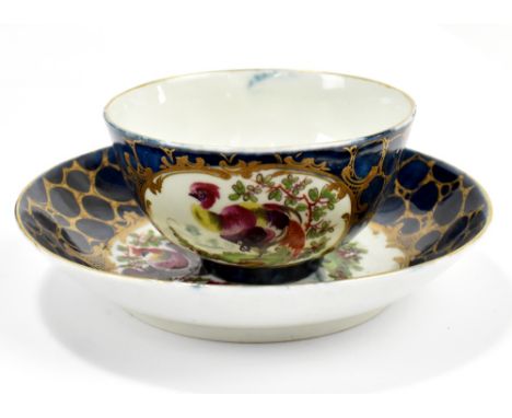 WORCESTER; an 18th century first period tea bowl and saucer, with cracked ice ground and panels decorated with dishevelled ex