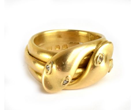 An 18ct yellow gold double entwined serpent ring, with diamonds set to the eyes, size N, approx 15.2g.Additional InformationL