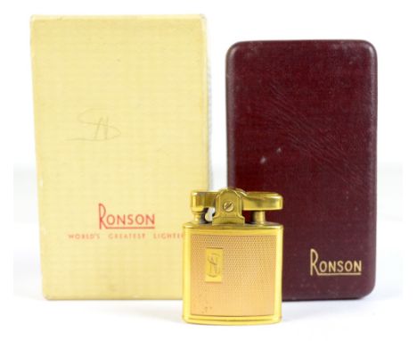 RONSON; a 9ct gold mounted lighter with engine turned decoration and with engraved initials SN, fitted in original box, appro