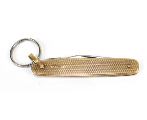 A 9ct gold pen knife with steel blades and engine turned decoration, length 8cm, total approx 33g.