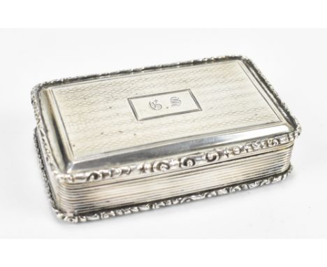 NATHANIEL MILLS; an early Victorian hallmarked silver snuff box of rounded rectangular form, with foliate decorated border an