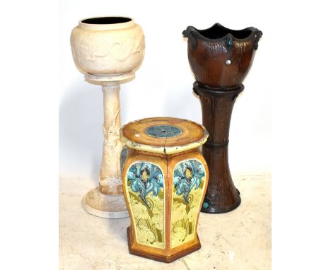 MINTON; a Secessionist range garden seat, height 53cm (af), also two Bretby jardinières on stands including a twin handled ex