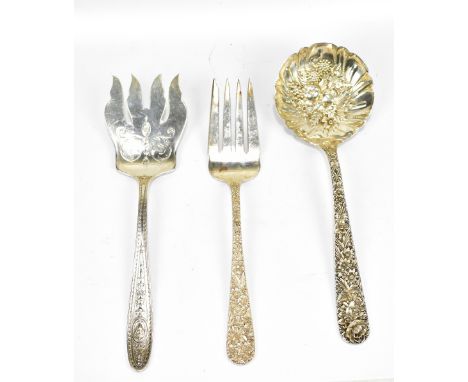 S KIRK &amp; SON; a white metal fish server, also a similar ladle, each with floral decoration stamped 'Sterling', and a serv
