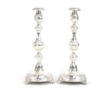 A pair of large late Victorian hallmarked silver Shabbat candlesticks with floral embossed decoration, London 1900, height 37