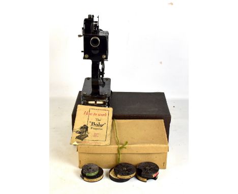 A Pathé&nbsp;baby projector, boxed with instructions and films.