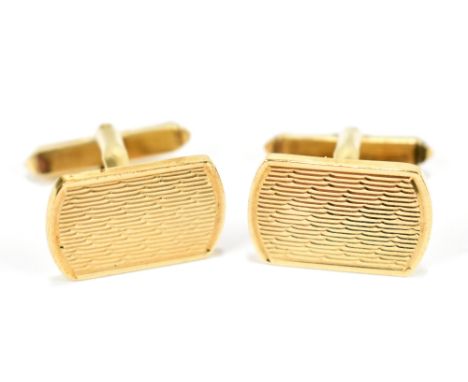 A pair of 9ct gold cuff links, each with engine turned decoration, approx 9.7g.
