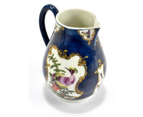 WORCESTER; an 18th century first period sparrow beak jug with blue scale ground and painted with exotic birds to the vignette