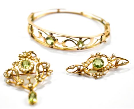 Three Edwardian items comprising a 9ct gold snap bangle with three peridot stones (larger af), a 9ct seed pearl and peridot p