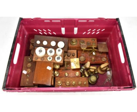 A collection of assorted brass postal scales and various weights, to include bell shaped examples, ceramic weights, etc.