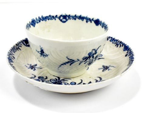 WORCESTER; an 18th century first period feather moulded tea bowl and saucer decorated with floral sprays, diameter of saucer 