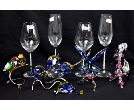 SWAROVSKI; four glass animals, to include four fish on chrome stand, also two champagne flutes and two wine glasses (part af)