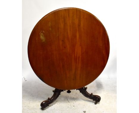 A Victorian mahogany circular breakfast table on turned carved tripod supports, diameter of top 127cm.