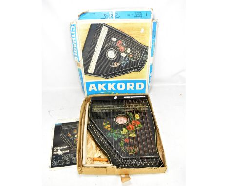 A boxed Musima Akkord zither, with instructions.