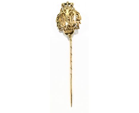 A 14ct gold stick pin, with crown finial above pierced decoration, bears impressed marks to pin for Fabergé, fitted in leathe