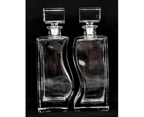 BOHEMIA; an opposing pair of clear glass decanters with etched marks to bases and square section stoppers, height 28cm (2).Ad