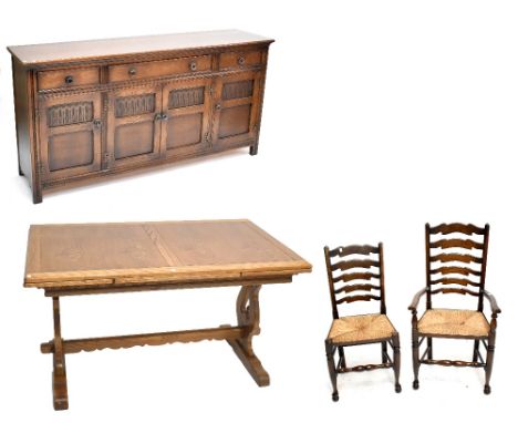 A reproduction oak dining suite comprising draw leaf dining table, six ladder back dining chairs, sideboard with drawers abov